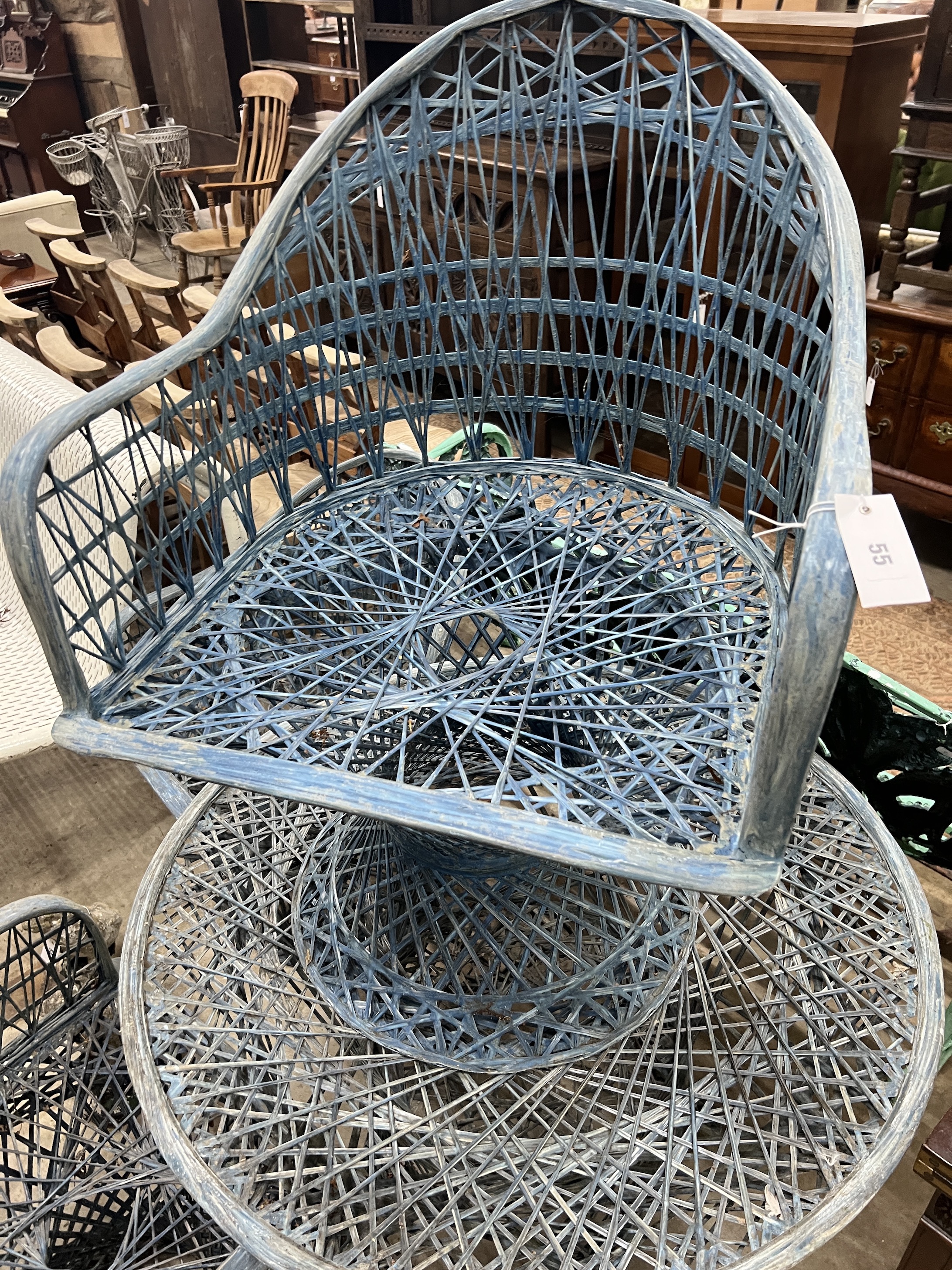 A Russell Woodard fibreglass garden table, diameter 89cm, height 70cm and three chairs